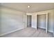 This carpeted bedroom features neutral walls and a closet at 4039 Tullamore Ln, Auburndale, FL 33823