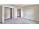 Neutral bedroom with carpet, a closet with doors, and a view into the hallway at 4039 Tullamore Ln, Auburndale, FL 33823