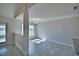 Well-lit dining area features a modern chandelier, neutral walls, and large format tile floors at 4039 Tullamore Ln, Auburndale, FL 33823