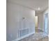 Hallway with neutral color scheme, leading to various rooms in the house at 4039 Tullamore Ln, Auburndale, FL 33823