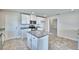 Bright kitchen with white cabinets, stainless steel appliances, and granite countertops at 4039 Tullamore Ln, Auburndale, FL 33823