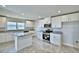 Kitchen featuring white cabinets, granite countertops, and stainless steel appliances at 4039 Tullamore Ln, Auburndale, FL 33823
