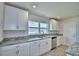 Modern kitchen features stainless steel appliances and granite countertops at 4039 Tullamore Ln, Auburndale, FL 33823