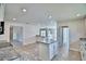 Bright kitchen with granite countertops, tile flooring, and an island at 4039 Tullamore Ln, Auburndale, FL 33823