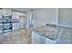 Kitchen with stainless steel appliances, granite countertops, and white cabinets at 4039 Tullamore Ln, Auburndale, FL 33823