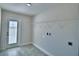 Functional laundry room with easy access to the backyard at 4039 Tullamore Ln, Auburndale, FL 33823