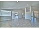 Spacious open-concept living space with tile flooring, recessed lights, and smooth walls at 4039 Tullamore Ln, Auburndale, FL 33823