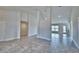 Open-concept living area with recessed lighting, neutral paint, and stylish tile flooring at 4039 Tullamore Ln, Auburndale, FL 33823
