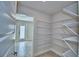 Spacious pantry with wire shelving for optimal storage at 4039 Tullamore Ln, Auburndale, FL 33823