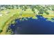 Aerial view of property and lakefront, showing lush vegetation at 420 W Gates Ave, Lake Hamilton, FL 33851