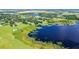 Aerial view of property near lake, showcasing homes and landscape at 420 W Gates Ave, Lake Hamilton, FL 33851