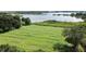 Aerial view of property showcasing expansive lakefront lot with lush greenery at 420 W Gates Ave, Lake Hamilton, FL 33851
