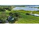 Aerial view of house and expansive lakefront lot with lush greenery at 420 W Gates Ave, Lake Hamilton, FL 33851