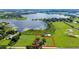 Aerial view showing a house on a large lot near a lake at 420 W Gates Ave, Lake Hamilton, FL 33851
