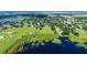 Aerial view showcasing a lakefront community and surrounding landscape at 420 W Gates Ave, Lake Hamilton, FL 33851