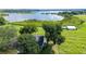Aerial view of property showcasing expansive lakefront lot with lush greenery at 420 W Gates Ave, Lake Hamilton, FL 33851