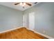 Bright bedroom with hardwood floors and ceiling fan at 420 W Gates Ave, Lake Hamilton, FL 33851