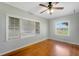 Spacious bedroom with hardwood floors and large windows at 420 W Gates Ave, Lake Hamilton, FL 33851