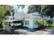 Light green house with carport and covered porch at 420 W Gates Ave, Lake Hamilton, FL 33851