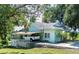 Light green house with carport and covered porch at 420 W Gates Ave, Lake Hamilton, FL 33851