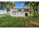 Light green house exterior with large yard at 420 W Gates Ave, Lake Hamilton, FL 33851