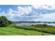 Scenic view of a tranquil lake with lush greenery and blue skies at 420 W Gates Ave, Lake Hamilton, FL 33851