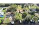 Aerial view of homes along the waterway, each with private docks and lush landscaping at 9650 W Lake Marion Rd, Haines City, FL 33844