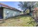 The side yard features a grassy area with partial fencing providing a secure and private outdoor space at 9650 W Lake Marion Rd, Haines City, FL 33844