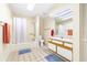 Bright bathroom with a shower-tub combo and a large single sink vanity at 9650 W Lake Marion Rd, Haines City, FL 33844
