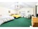 Large primary bedroom features vaulted ceilings, cozy furniture and ample natural light at 9650 W Lake Marion Rd, Haines City, FL 33844