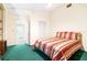 Bedroom featuring a comfortable bed, access to ensuite bathroom, and a closet at 9650 W Lake Marion Rd, Haines City, FL 33844