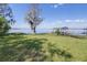 Picturesque lake view with a private dock featuring a covered boat lift for convenient water access at 9650 W Lake Marion Rd, Haines City, FL 33844