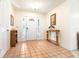 Inviting foyer with neutral walls, tiled flooring, and decorative table near the front door at 9650 W Lake Marion Rd, Haines City, FL 33844