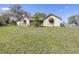 Spacious front yard, mature trees, and lush landscaping at 9650 W Lake Marion Rd, Haines City, FL 33844