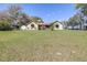 Lovely front lawn with an American flag gracing this quaint one-story home at 9650 W Lake Marion Rd, Haines City, FL 33844