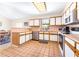 Well-lit kitchen featuring white cabinets, stainless steel appliances, and tile flooring at 9650 W Lake Marion Rd, Haines City, FL 33844