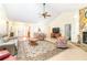 Bright living room with tiled floors, a stone fireplace, and an open floor plan at 9650 W Lake Marion Rd, Haines City, FL 33844