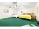 Spacious main bedroom with vaulted ceiling, ceiling fan, and green carpet at 9650 W Lake Marion Rd, Haines City, FL 33844