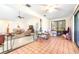 Open concept living room and sunroom with tile flooring and bright lighting at 9650 W Lake Marion Rd, Haines City, FL 33844