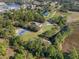 Aerial view showing house, pool, and sports court at 222 Rod Ln, Davenport, FL 33837