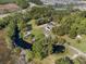 Aerial view showing home, pool, and surrounding landscape at 222 Rod Ln, Davenport, FL 33837