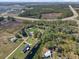 Aerial view of property showing home and surrounding land at 222 Rod Ln, Davenport, FL 33837