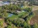 Aerial view showing house, pool, and sports court at 222 Rod Ln, Davenport, FL 33837