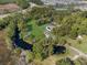 Aerial view showcasing home, pool, and surrounding landscape at 222 Rod Ln, Davenport, FL 33837