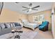 Bedroom with bed, sofa, and drum set at 222 Rod Ln, Davenport, FL 33837