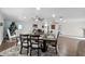 Bright dining area with hardwood floors and modern light fixtures at 222 Rod Ln, Davenport, FL 33837