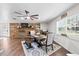 Dining area with hardwood floors and brick fireplace at 222 Rod Ln, Davenport, FL 33837