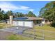 Ranch home with three-car garage and solar panels at 222 Rod Ln, Davenport, FL 33837