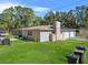 House exterior showcasing a side view and lawn at 222 Rod Ln, Davenport, FL 33837