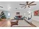 Living room with hardwood floors and a cozy seating area at 222 Rod Ln, Davenport, FL 33837